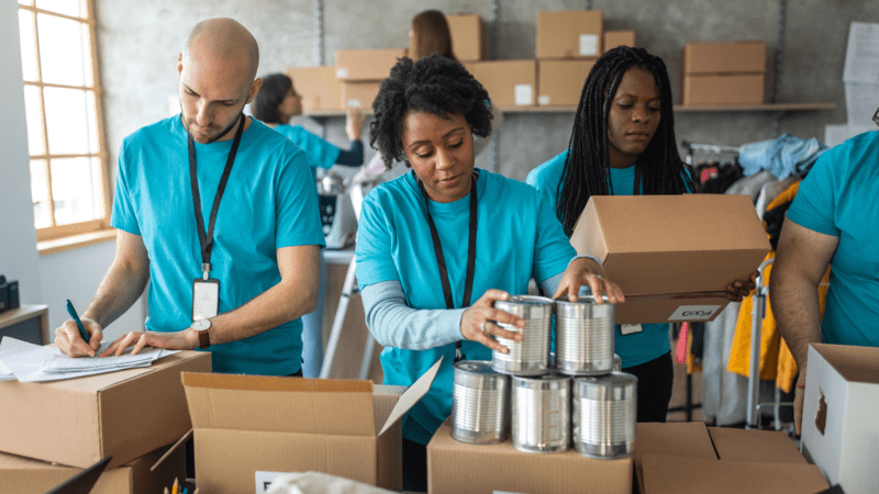 Image of a group of corporate volunteers working together in a food pantry.